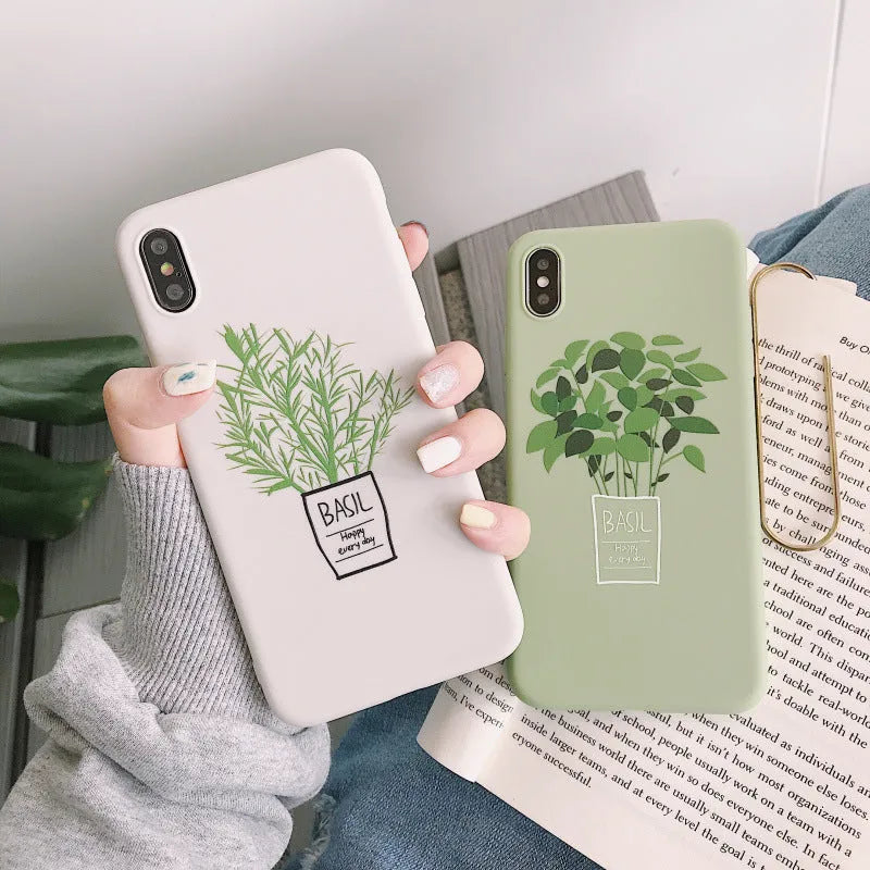 White silicone iPhone case with detailed green painted plant leaves design on the back.