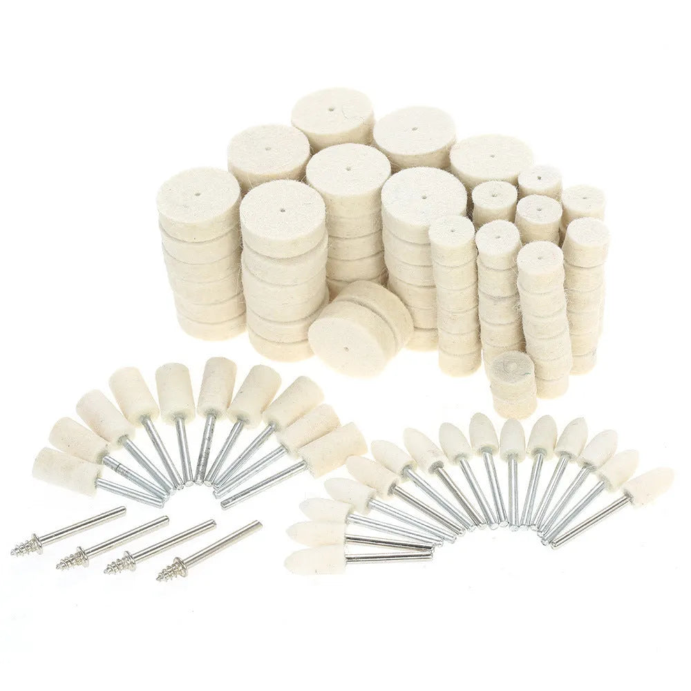 129 piece polishing wheel kit with white wool brushes and metal handles on a table