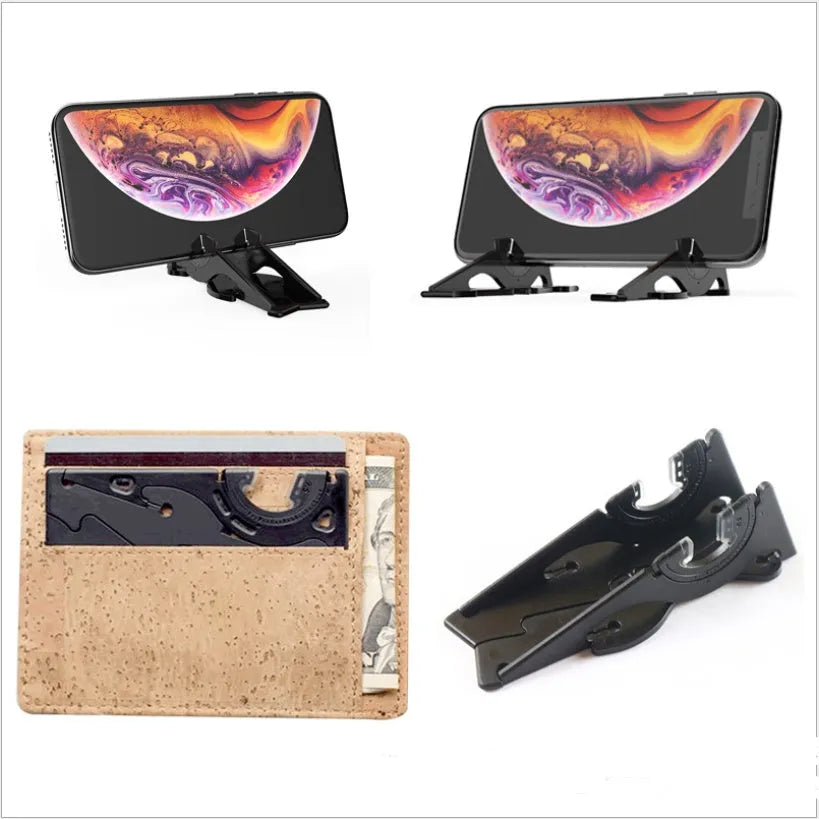 Black plastic card type mobile phone holder on desktop surface
