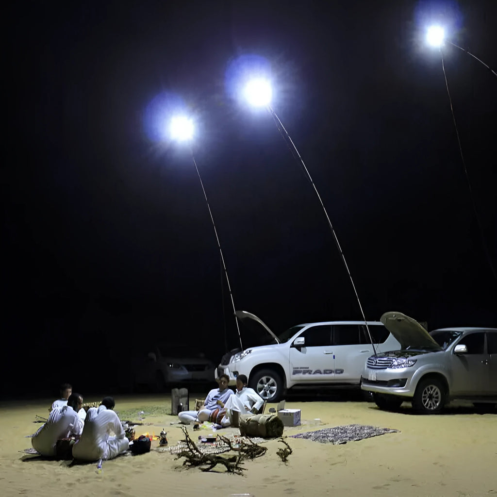 White LED fishing rod light with telescopic pole extended, showing remote control and connection cables
