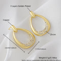 Women's yellow gold geometric drop earrings with ring and oval elements measuring 2.6 by 1.7 cm