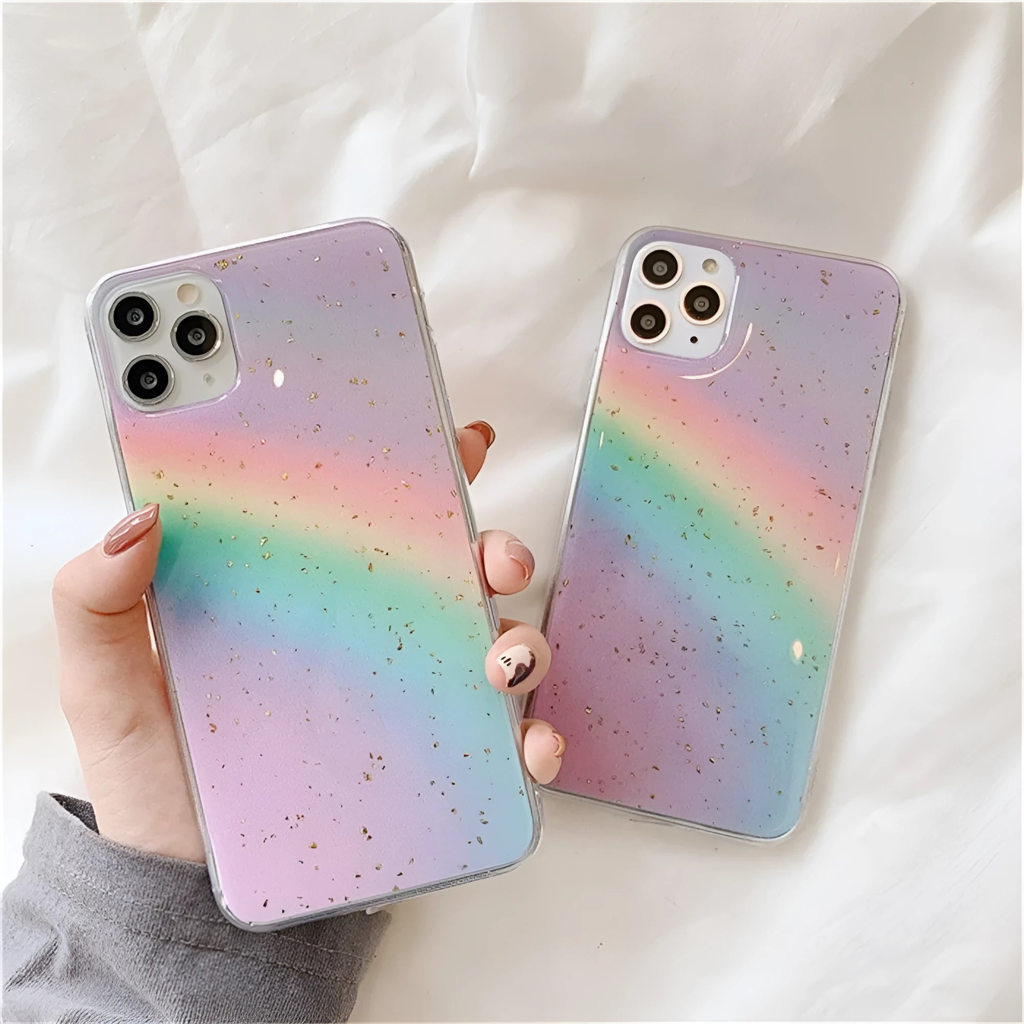 Rainbow gradient striped TPU protective case for iPhone models on a white background.