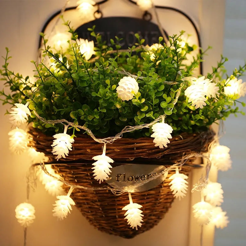 LED pine cone decorative light string with warm white bulbs and plastic shells, battery powered for flexible placement