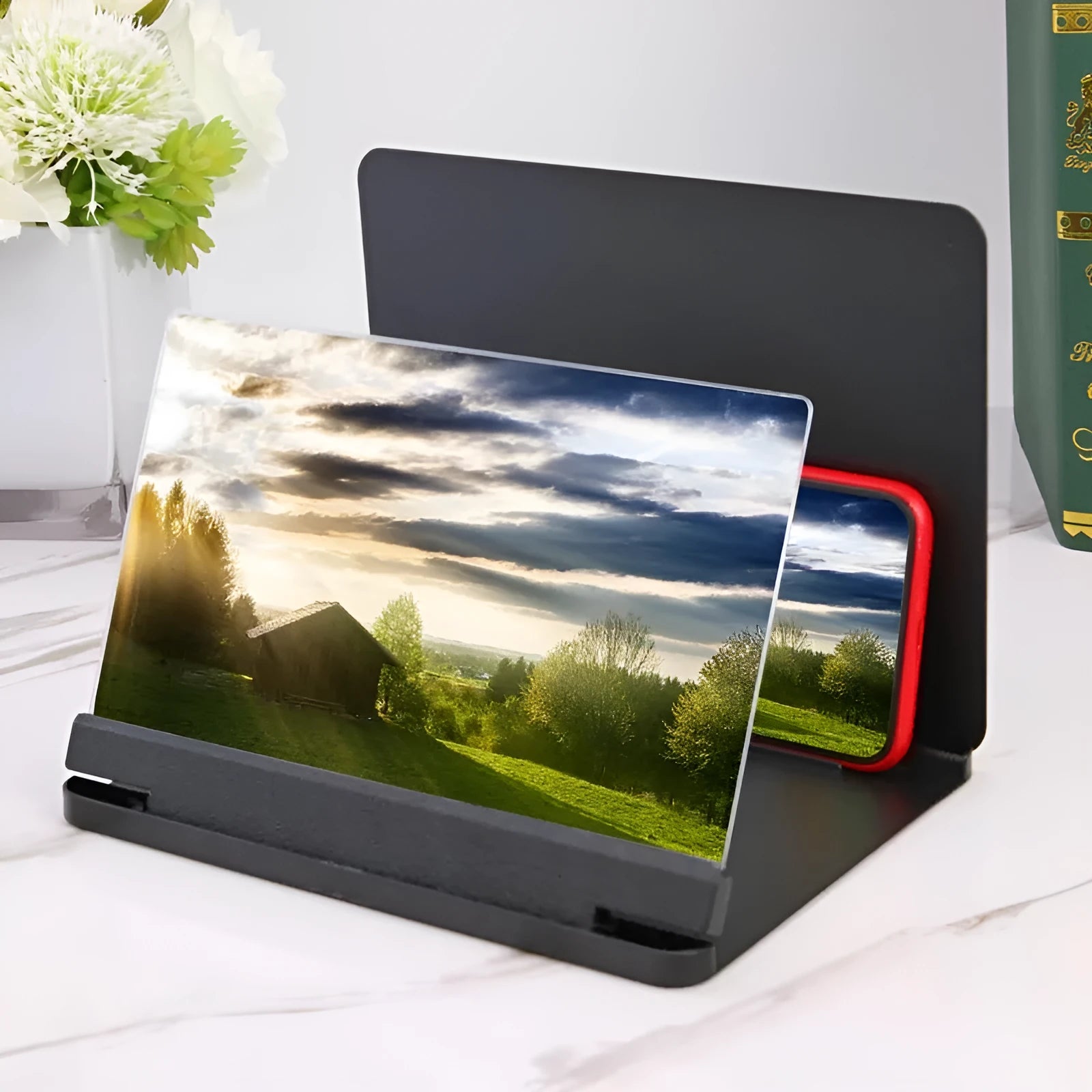 White phone screen amplifier showing smartphone magnification with plexiglass lens and fibreboard base