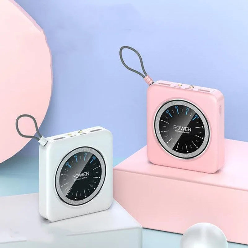 Mini clock portable power bank in an alloy case with multiple USB ports, shown in mint green colour.