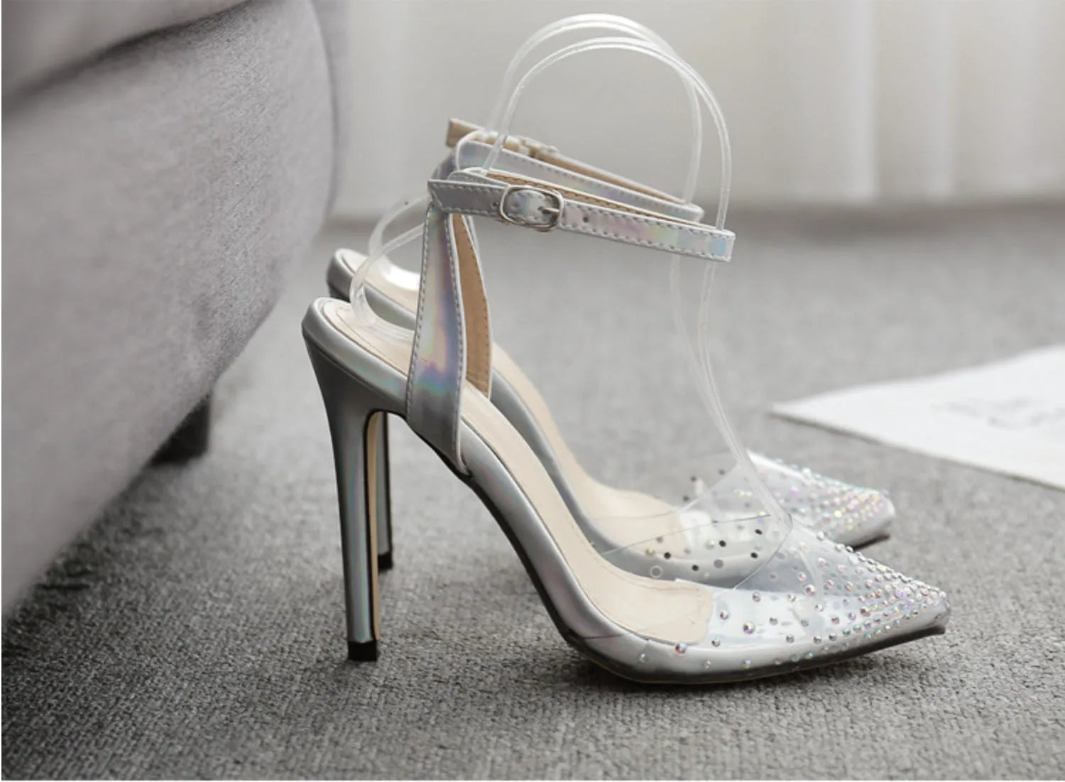 Women's pointed toe diamond sandals with stiletto heel on a white background.