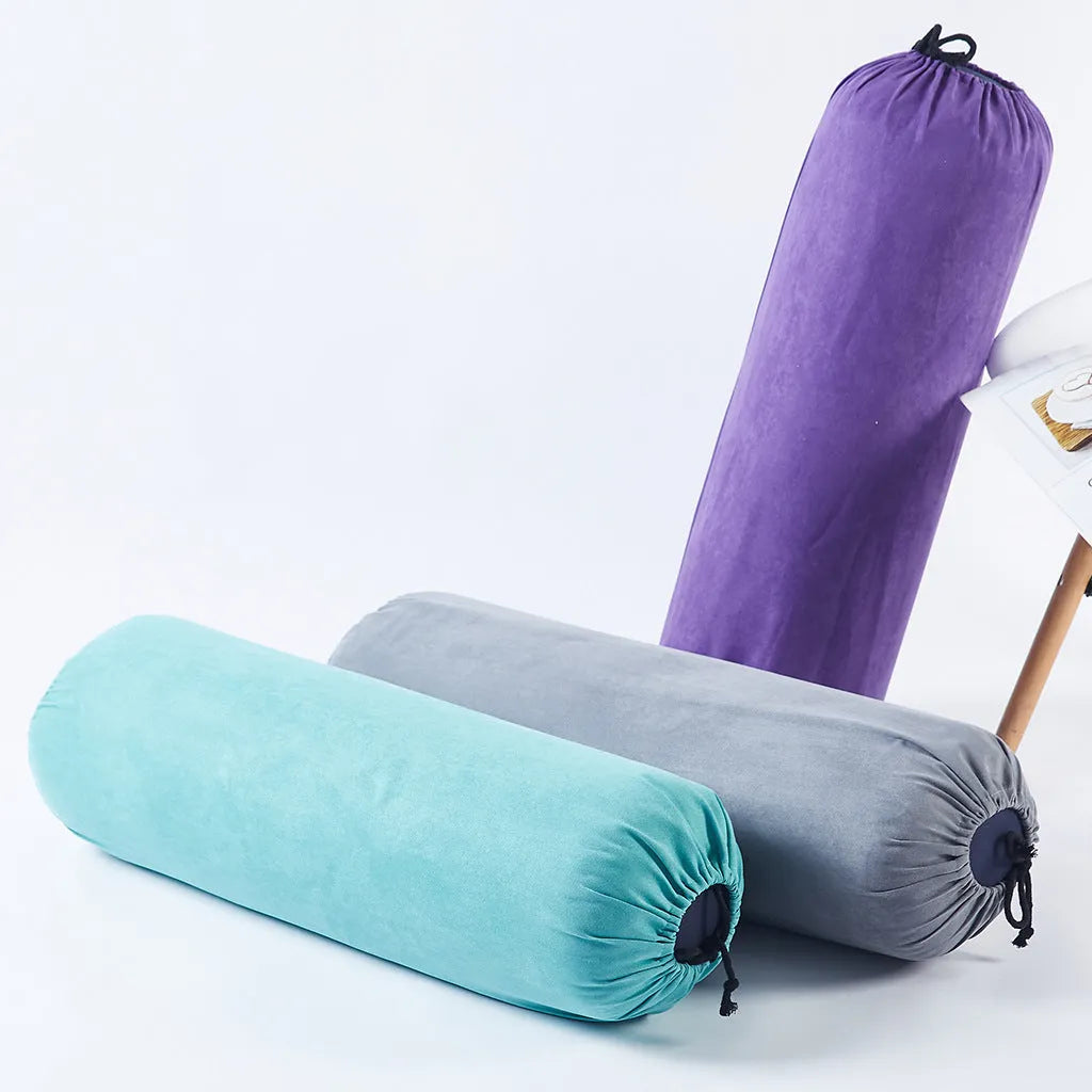 Cotton and linen yoga auxiliary pillows in four colours: blue, green, grey, purple, placed on a living room floor