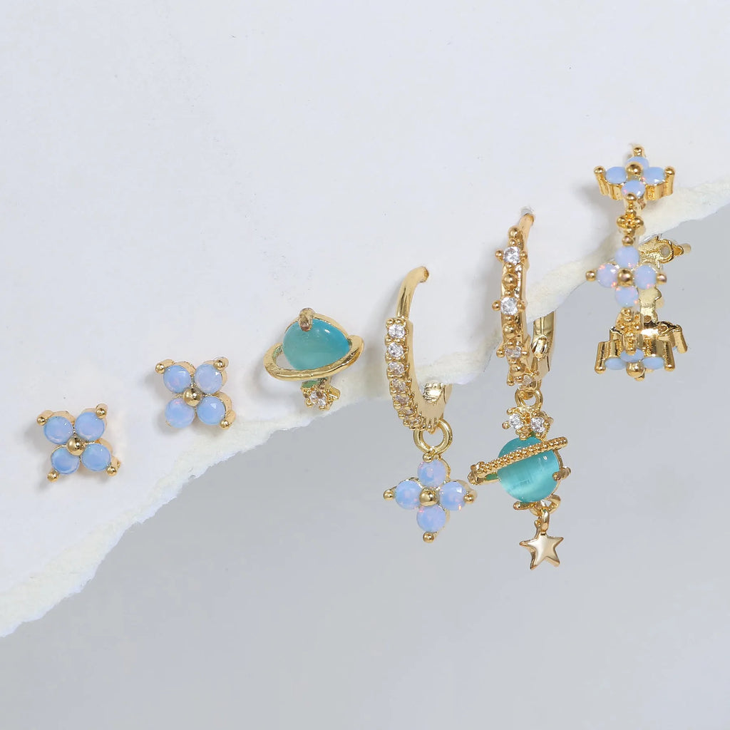 Gold and silver flower-shaped ear studs with zircon mosaic accents in Japanese Korean style