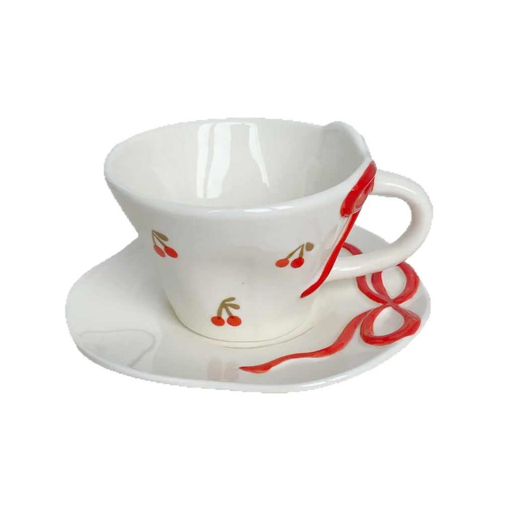 Hand painted white porcelain coffee cup with cherry design and matching coaster