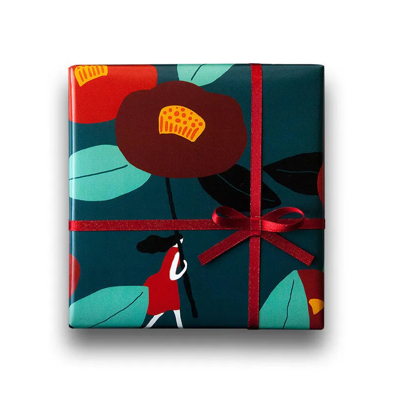 Green waterproof Christmas gift wrapping paper with Camellia design and black ribbon for gift boxes