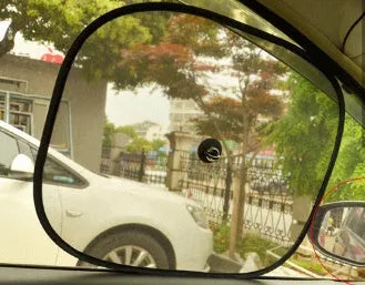 Black net yarn car sunshade sunscreen folded on car dashboard for glare reduction