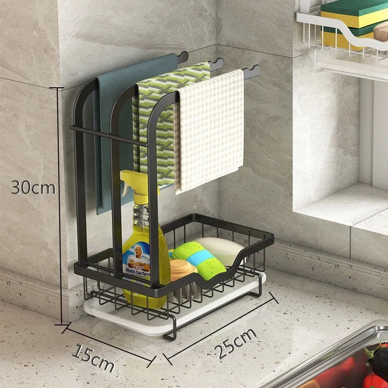 Foldable white plastic kitchen rack for wall mounting or desktop use, holding a sponge and cloth.