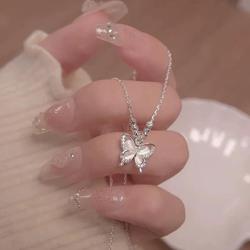 Women's square line opal butterfly necklace on a silver cross chain, adjustable from 41cm to 50cm.