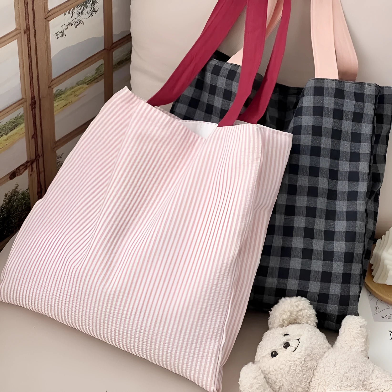 Casual multi-layer canvas tote shoulder bag in a plaid pattern with a wide strap.