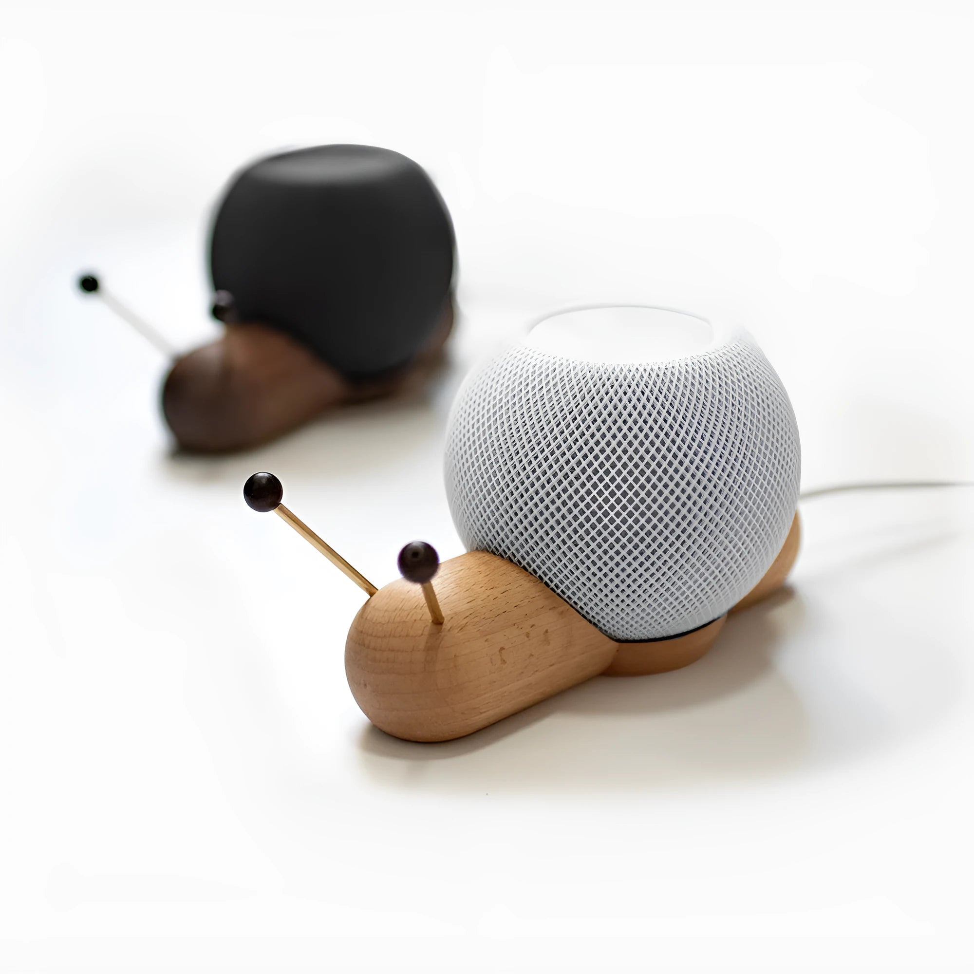 Khaki brown desktop non-slip bracket holding a smart Bluetooth speaker.