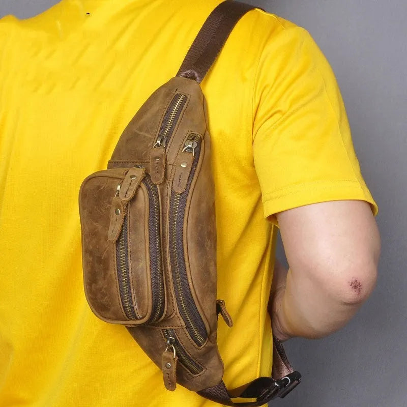 Genuine cowhide leather messenger bag in dark crazy horse colour showing shoulder strap and main compartment.