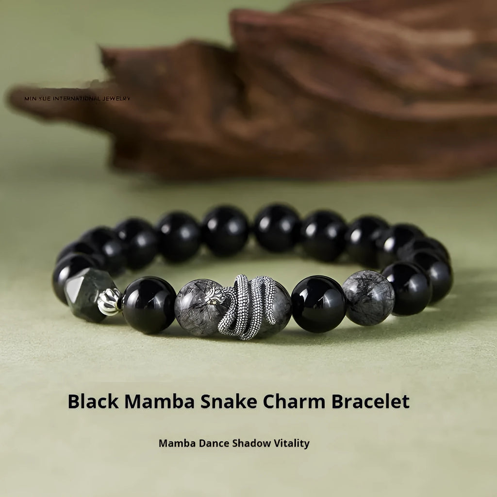 Men's black obsidian and sterling silver snake bracelet with retro design on a wrist.