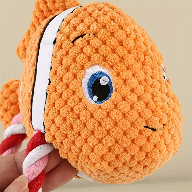 Grey turtle-shaped plush dog chew toy with knotted body and squeaker.