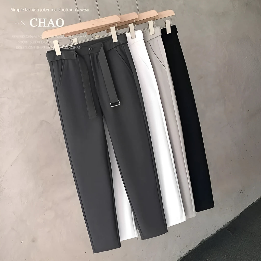 Boy wearing slim straight grey wool blend business casual trousers with a tapered fit