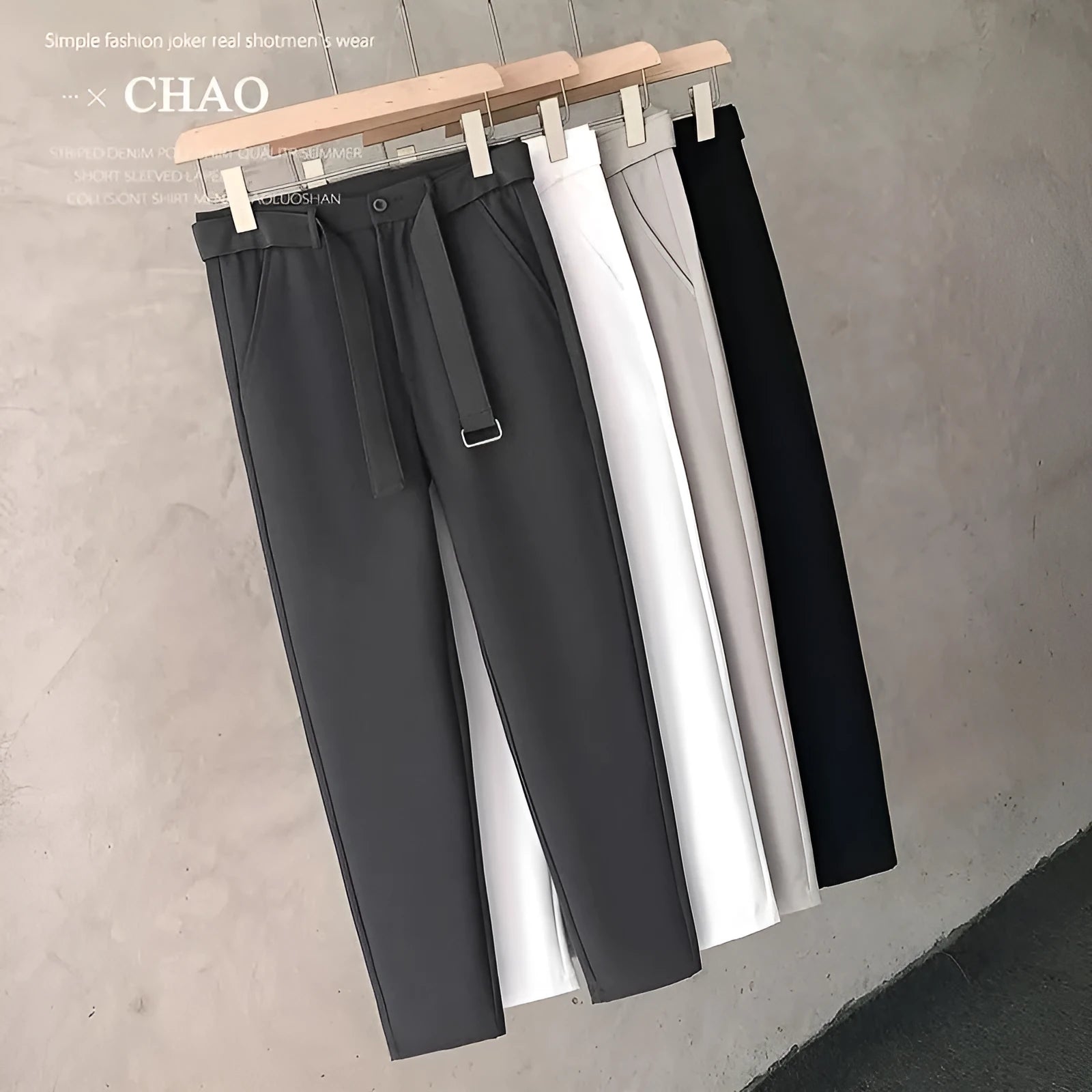 Boy wearing slim straight grey wool blend business casual trousers with a tapered fit