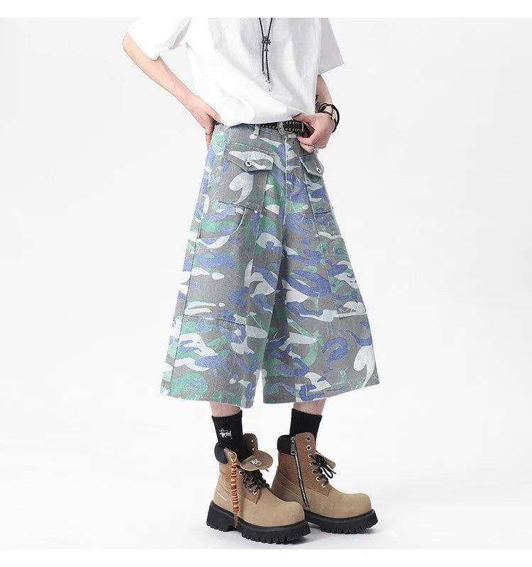 Camouflage denim work trousers with cargo pockets and straight leg cut