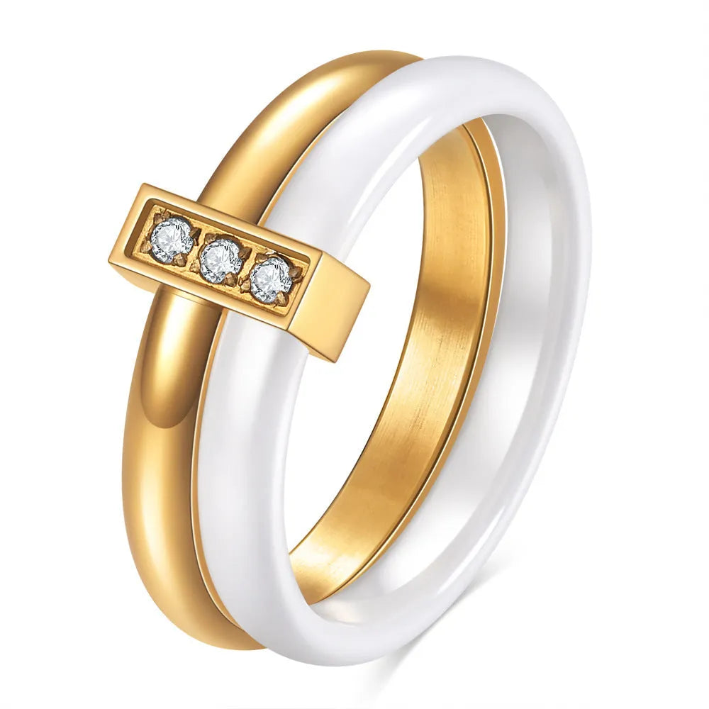 Ceramic geometric ring with glossy stitching and inlaid zirconium on 6MM band, shown in steel black and gold white finishes