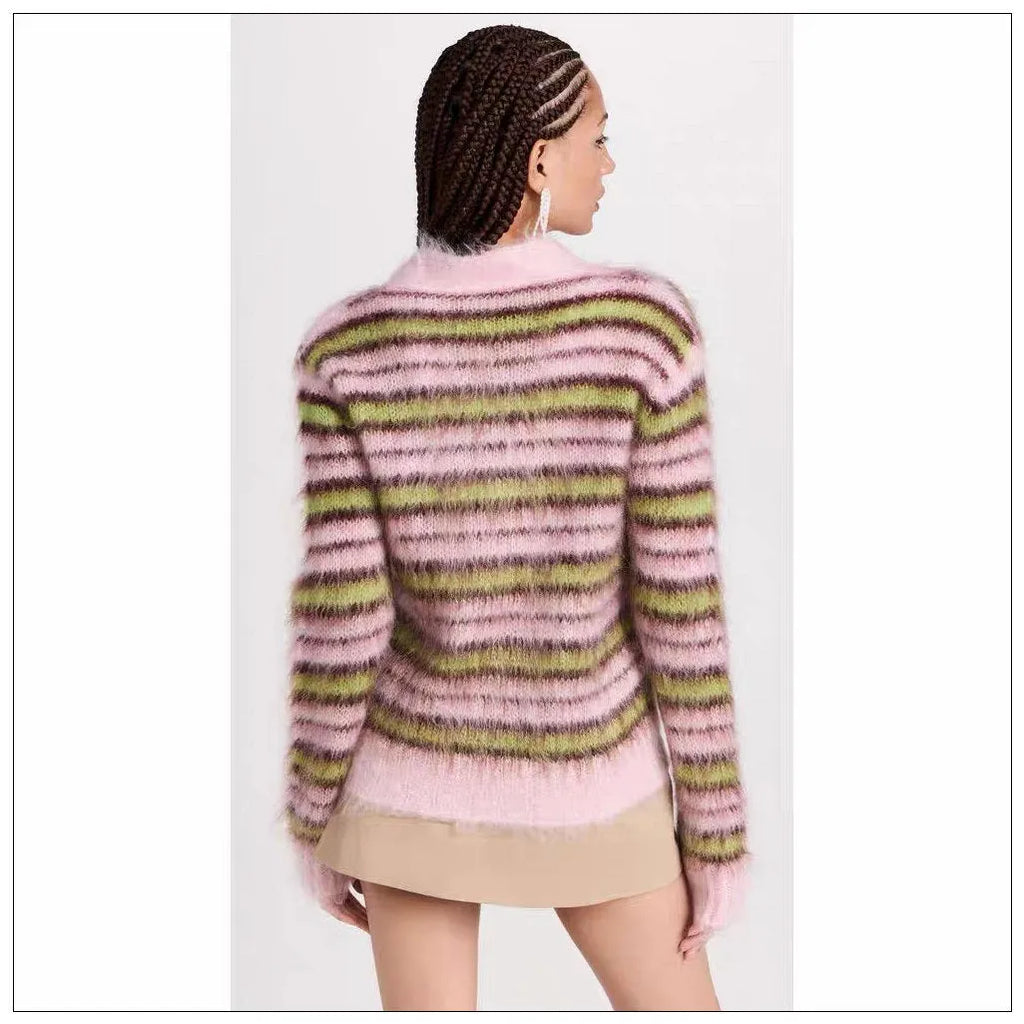 Pink wool knitted cardigan sweater with round collar on a hanger