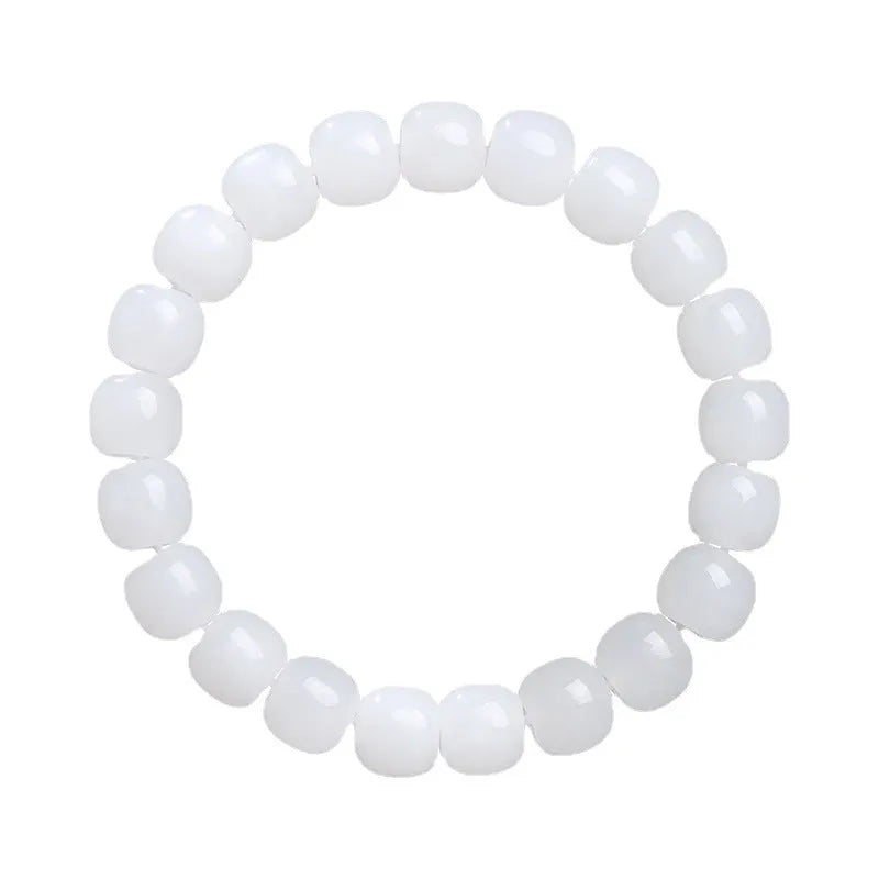 White Hetian jade barrel bead bracelet on wrist, showing unisex design and elasticated band.