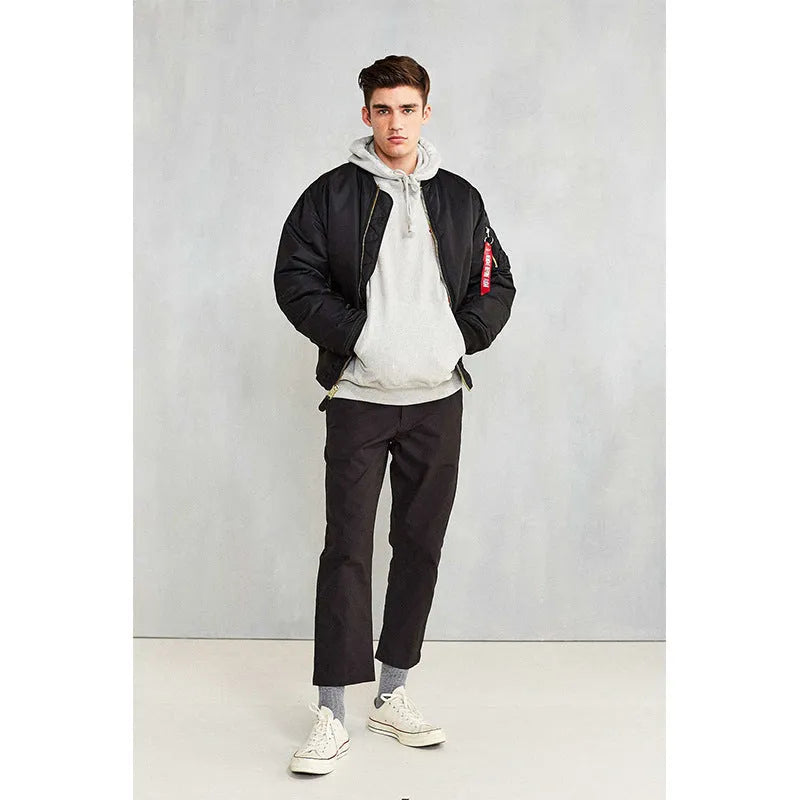 Men's army green loose fit nylon pilot jacket with cotton padding on a hanger.
