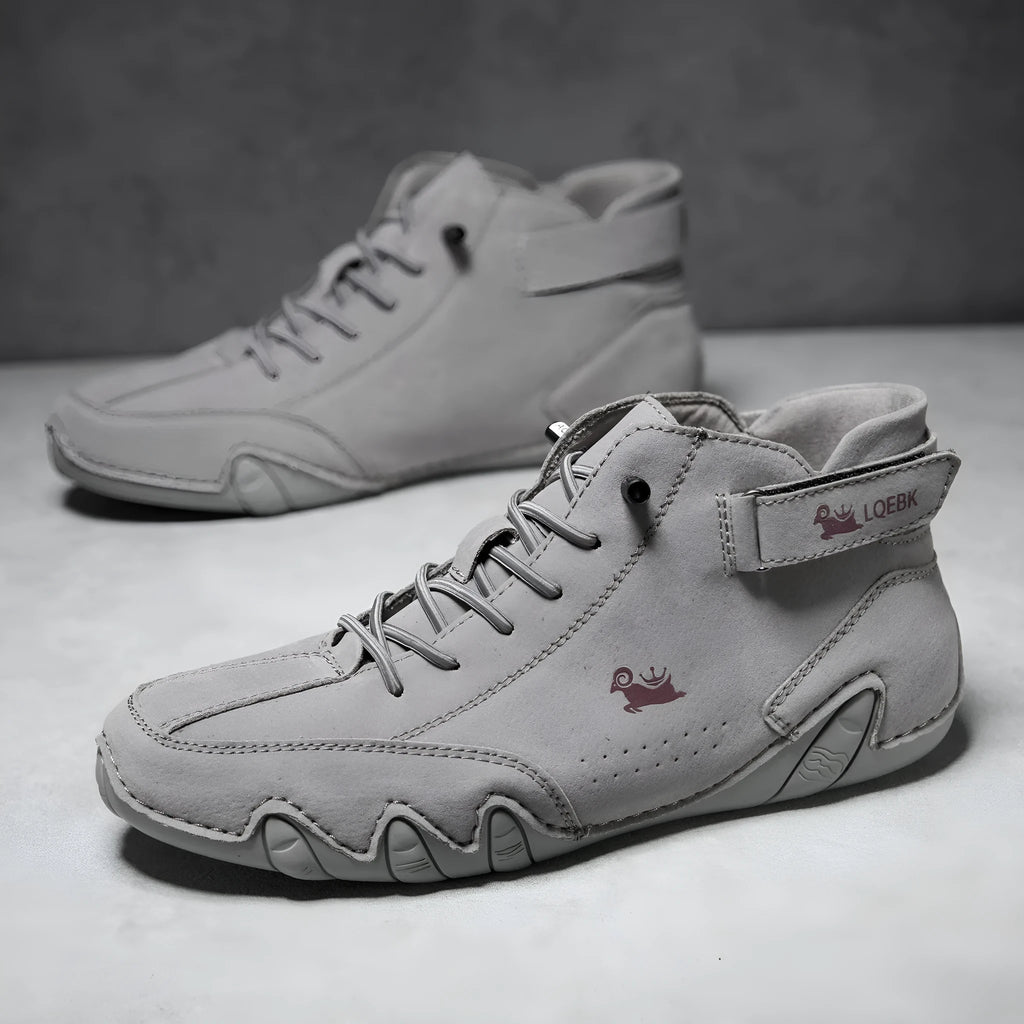 Men's brown high-top Martin boot with lace-up front, round toe, and flat rubber sole on a white background