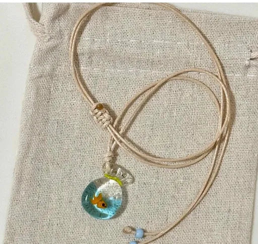 Women's pendant necklace with coloured glaze charm on a cotton and linen clavicle chain in Small Fish Lucky Bag colour.