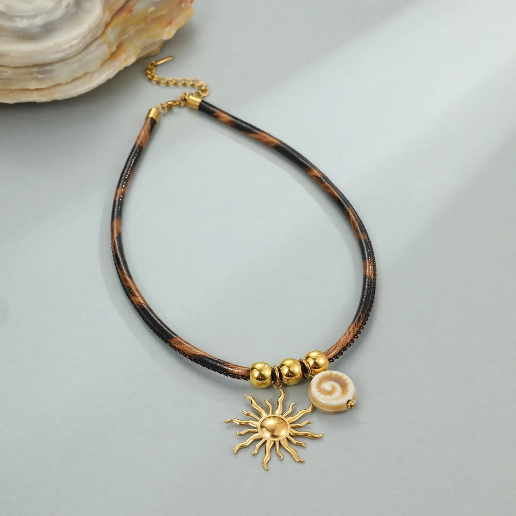 Women's stainless steel leopard pendant necklace with geometric design and gold-plated finish on adjustable chain