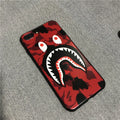 Frosted silicone phone case with shark mouth design in red, green, gray, and pink colours
