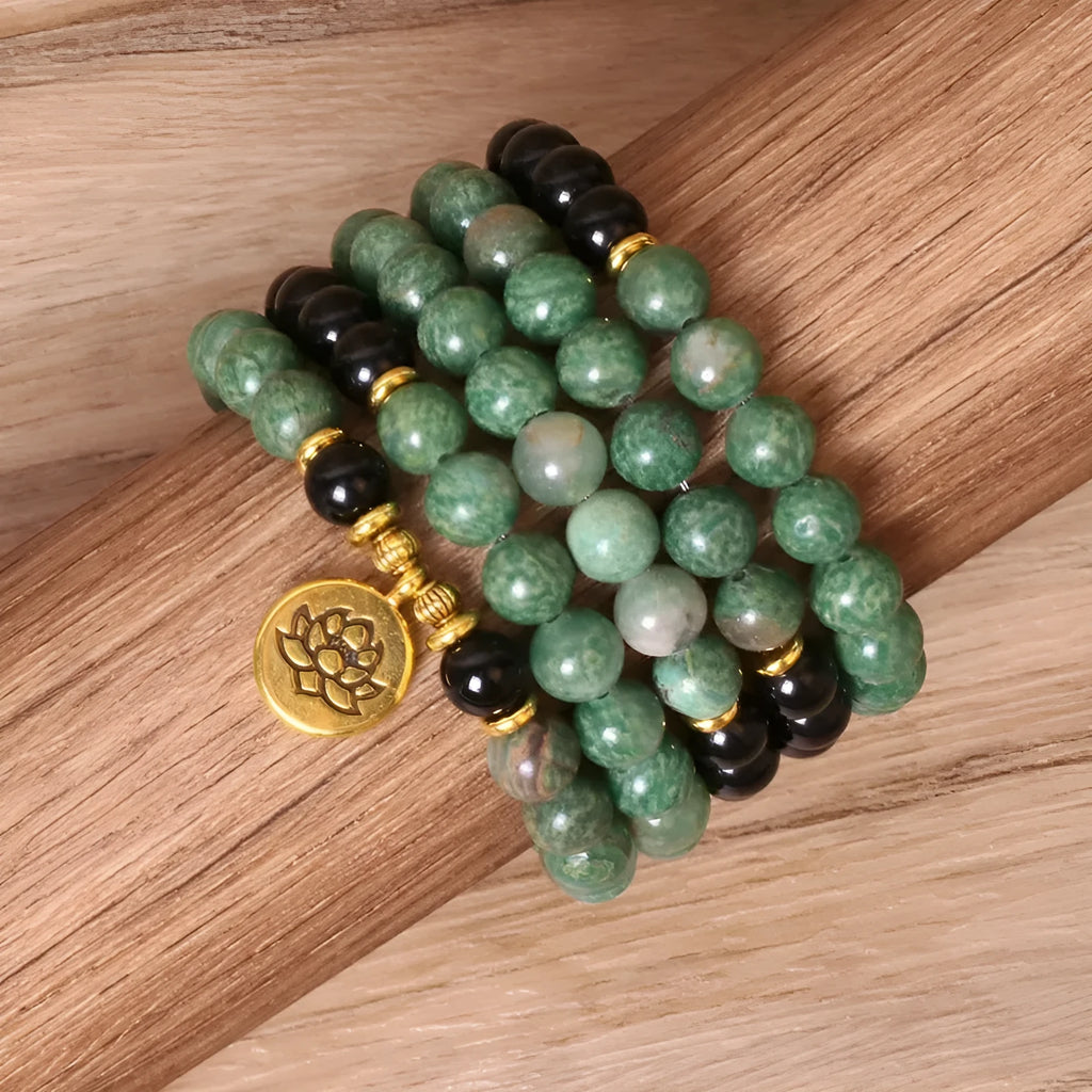 Green and black elastic beaded alloy bracelet showing stretch design and natural style