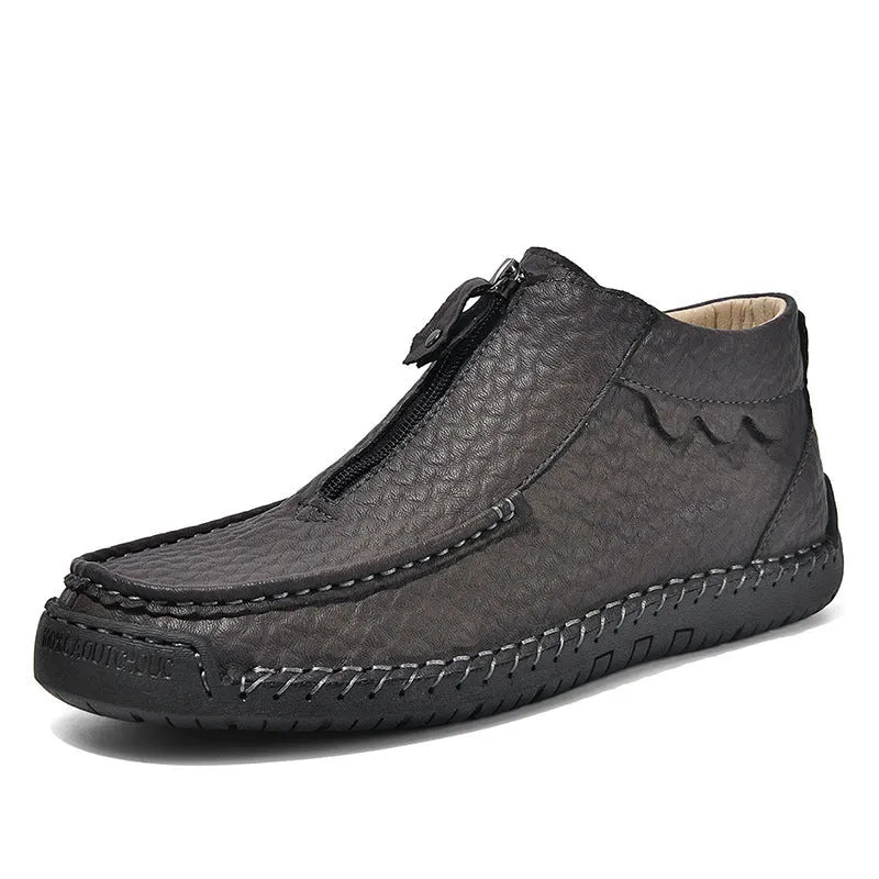 Men's brown slip-on leather loafers with round toe and rubber sole shown from side view
