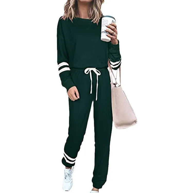 Women's loose-fitting casual suit in solid colour, showing long sleeve top and trousers in cotton blend fabric.