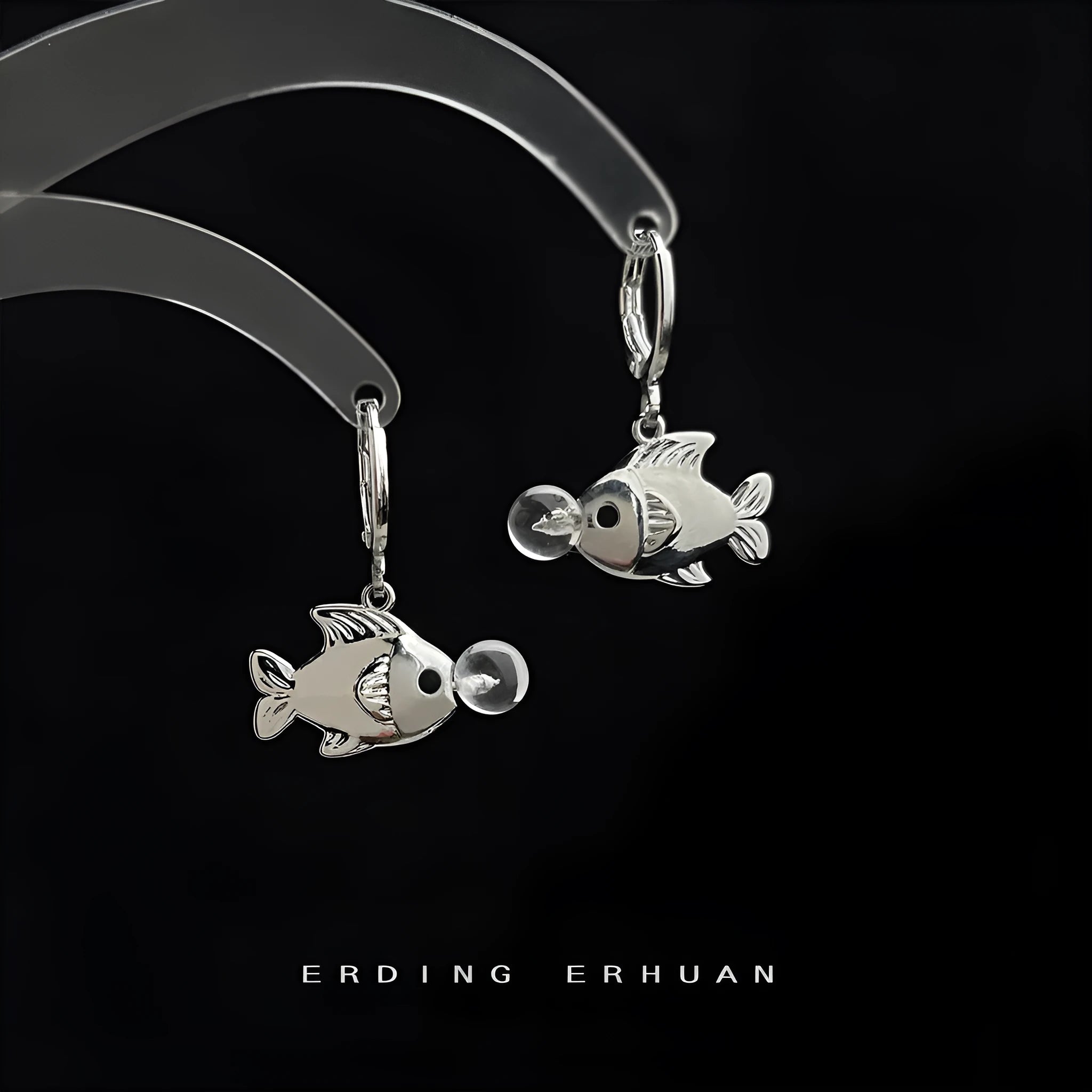 A pair of goldfish-inspired bubble fish design earrings with an electroplated finish on a copper base.