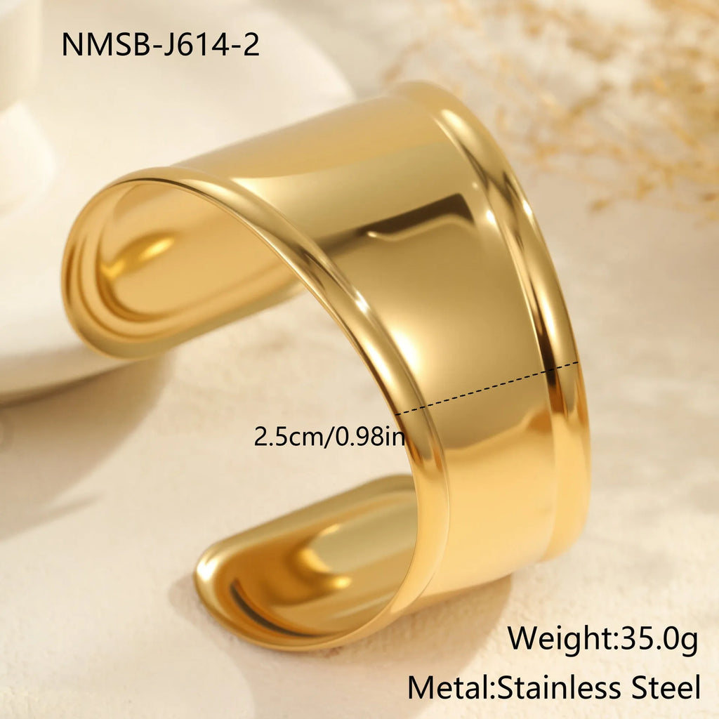 Women's wide fashion bracelet with geometric wave design in gold plating on stainless steel