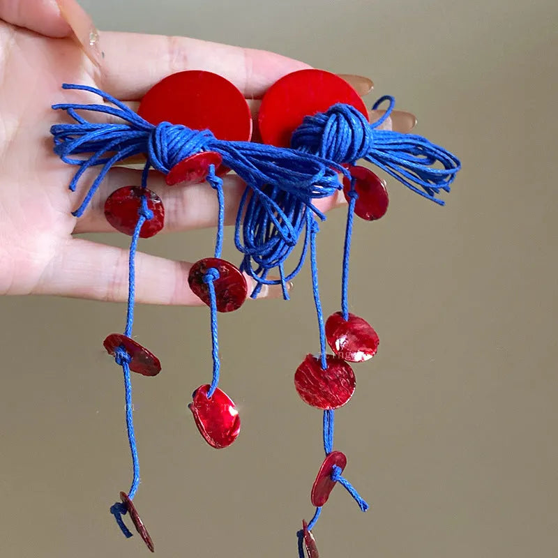 Women's geometric cloth earrings with blue resin flower detail and Silver Needle colour