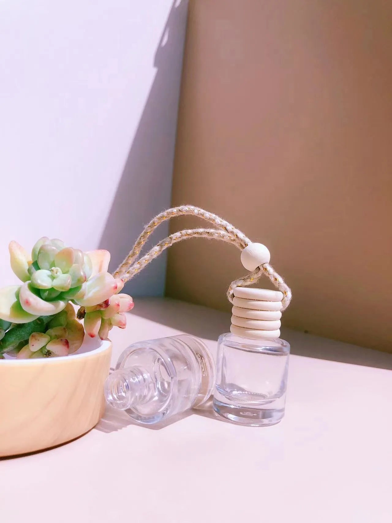 Car perfume pendant in glass with four style options for vehicle air freshening