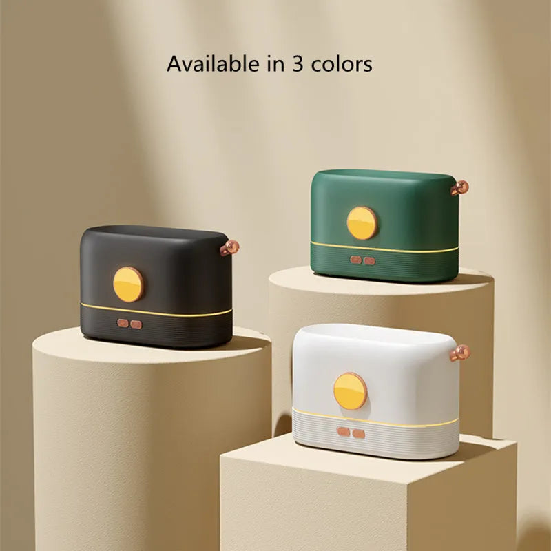 Black desktop humidifier with flame effect light and mist output, showing USB port and water tank.