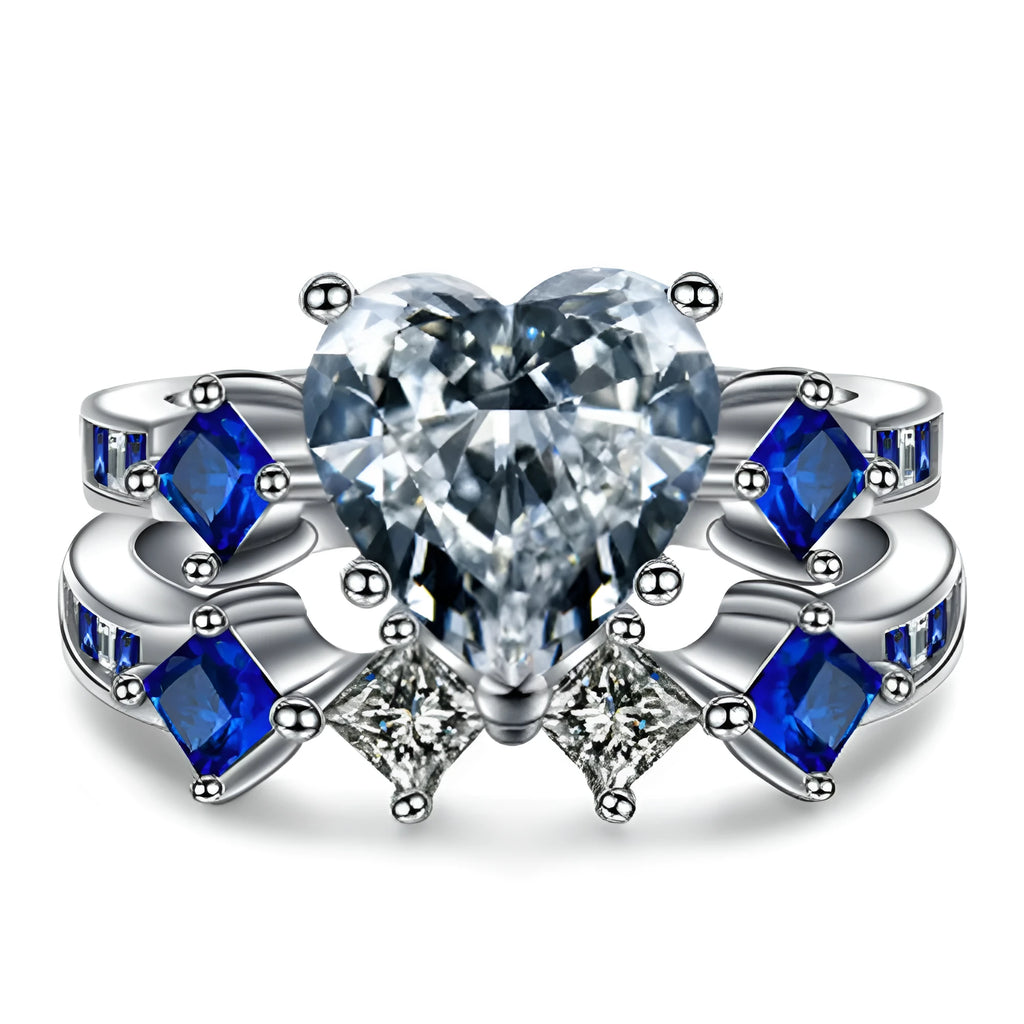 Silver-tone alloy heart-shaped geometric ring set on hand showing silver finish and multiple rings