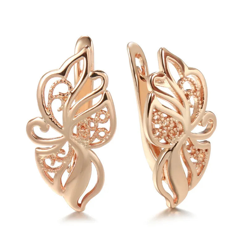 Rose gold copper earrings with hollow carved geometric design and rhinestone accents for women