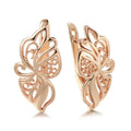 Rose gold copper earrings with hollow carved geometric design and rhinestone accents for women