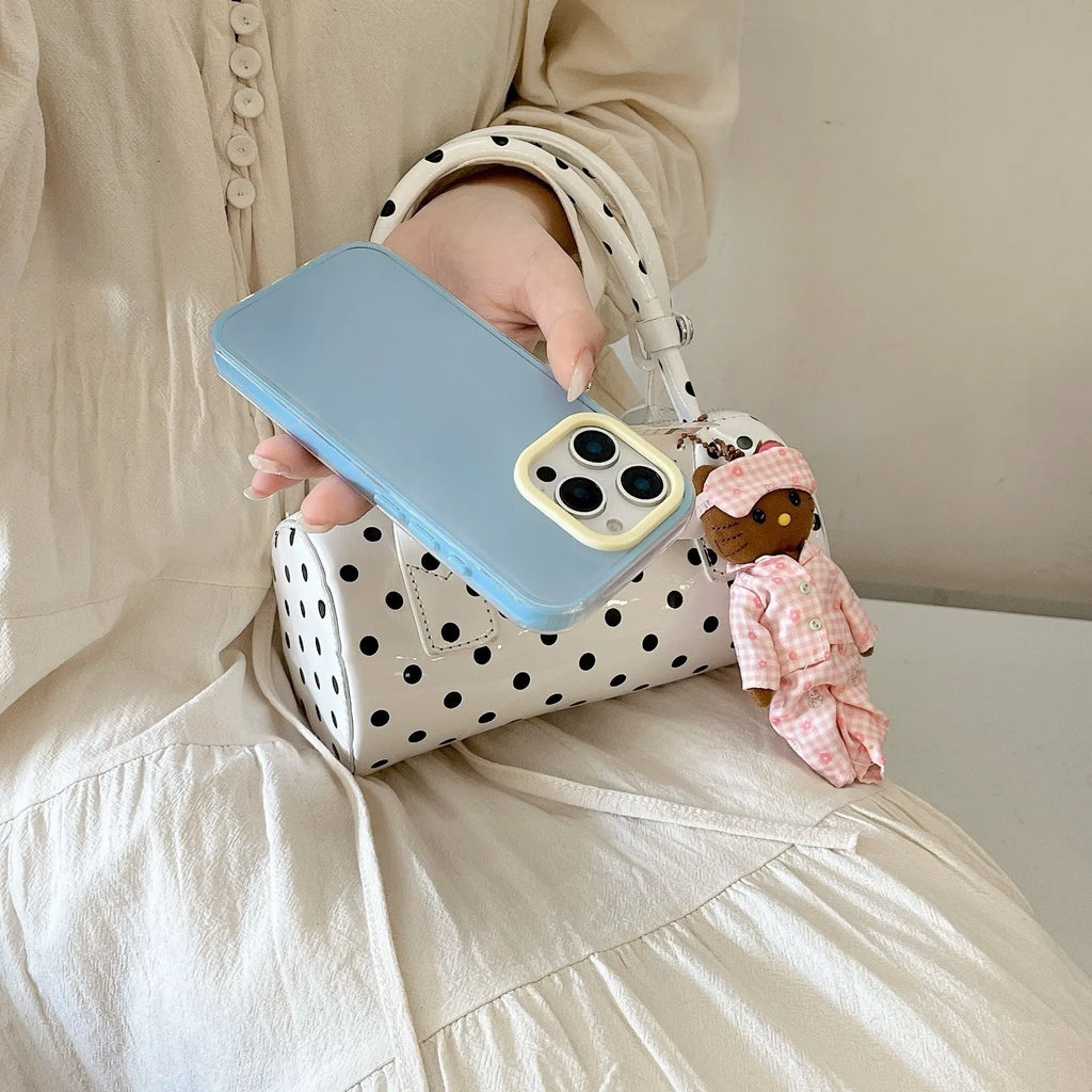 Simple solid colour jelly TPU phone case for iPhone, shown in blue, white and yellow.