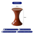 A plastic hourglass-shaped shoe changing stool in a choice of five colours.