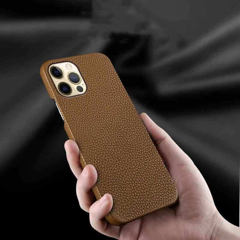 Genuine leather protective case for Apple iPhone in a selection of colours on a table.
