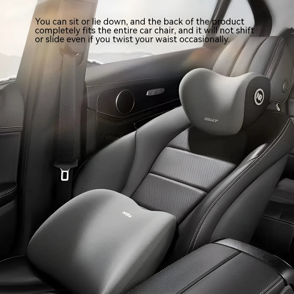 Black memory foam car lumbar support pillow and matching headrest on a car seat.