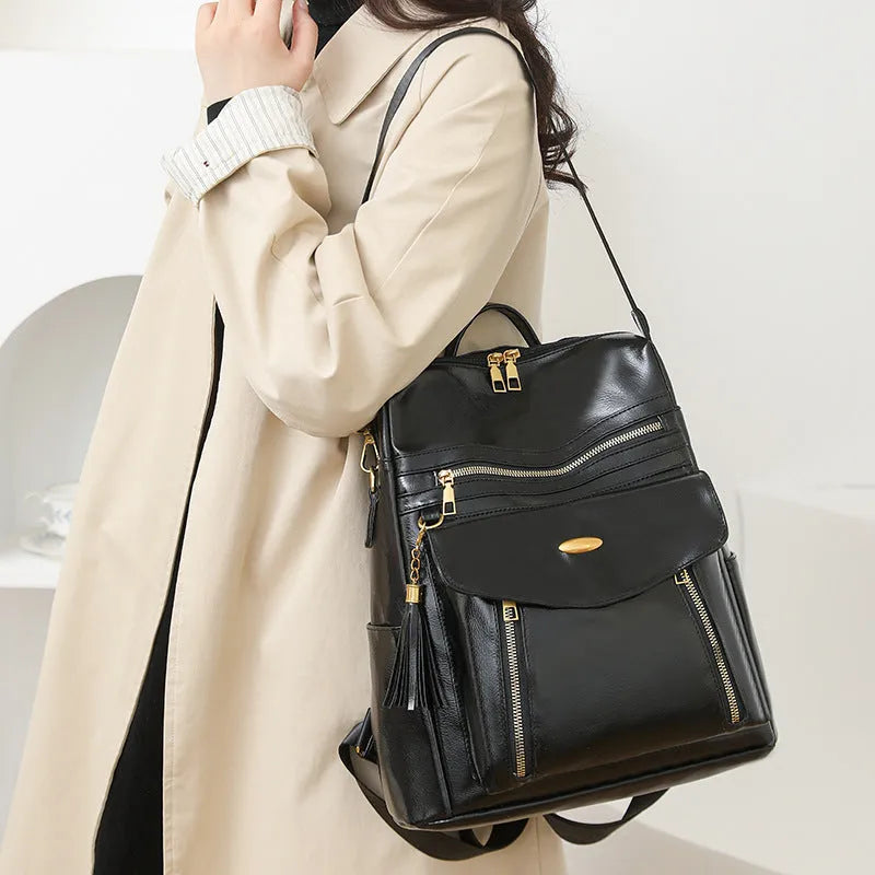 Crossbody casual ladies backpack in PU material with sewing thread detail, available in black, brown, and coffee