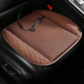 Black suede car seat cushion with USB cable and multiple cooling fans visible, placed on a car seat.